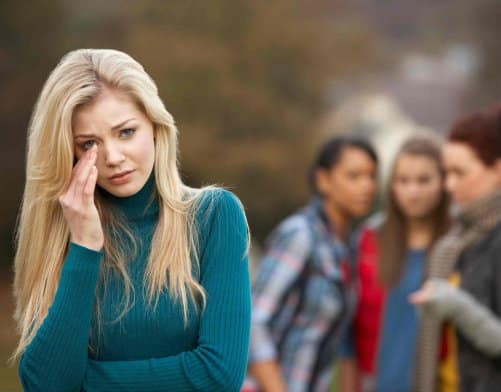 Bullied teen, and her Bullies in the background