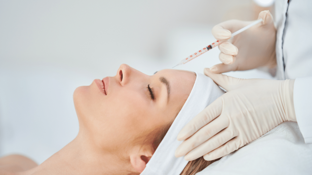 Woman getting facial injection.