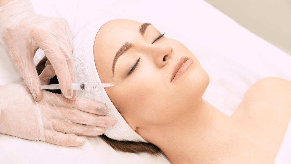 Woman getting facial injection. 