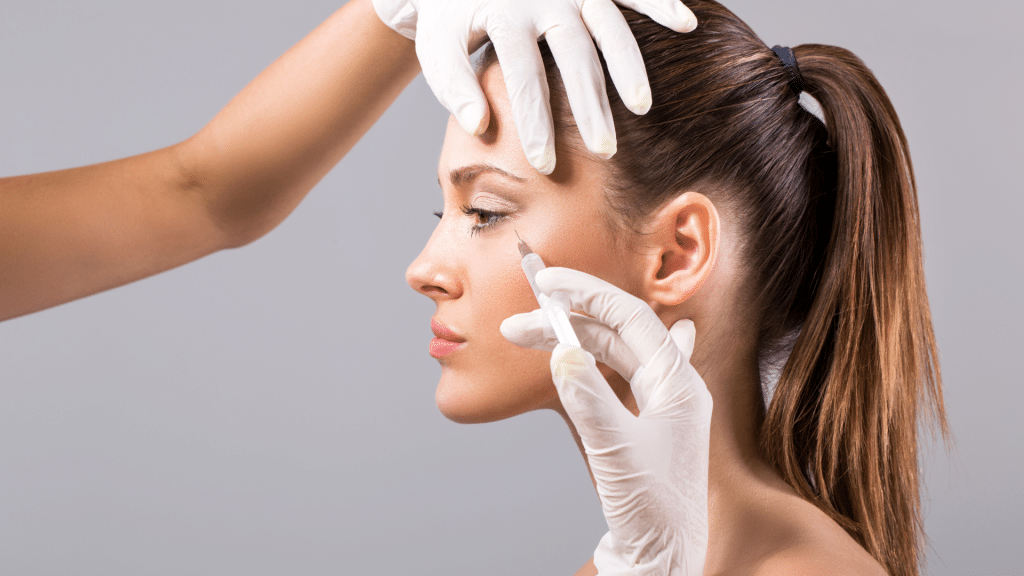 Woman getting a filler injection.