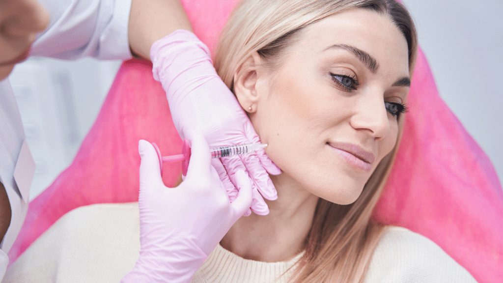 Woman getting facial injections.